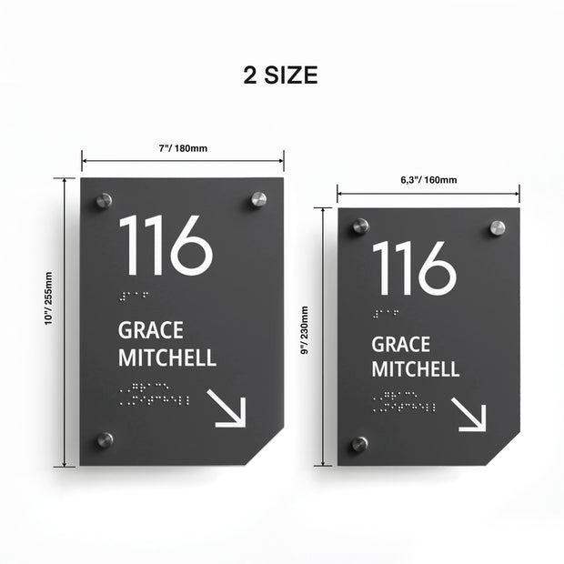 a pair of black and white street signs on a wall