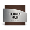 a treatment room sign with the text "TREATMENT ROOM" prominently displayed. - Photo #1