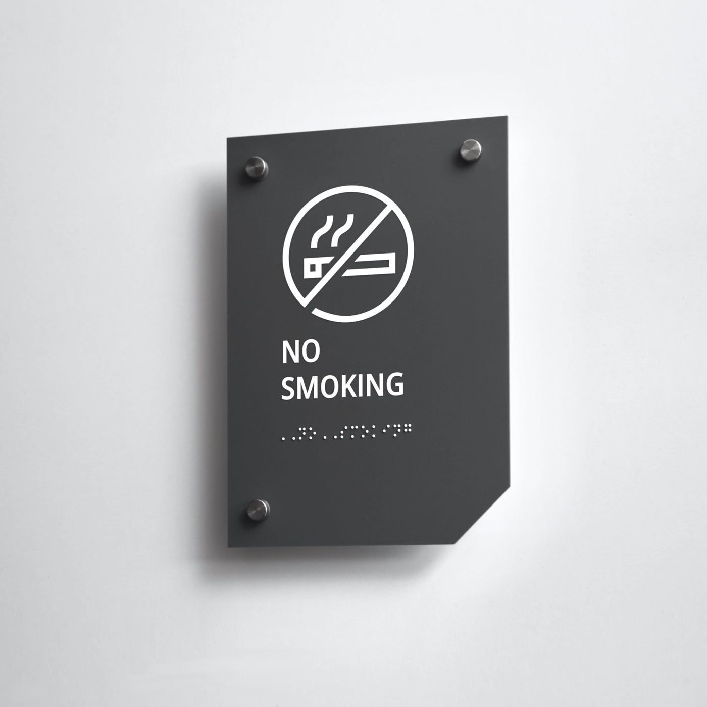 a no smoking sign on a white wall