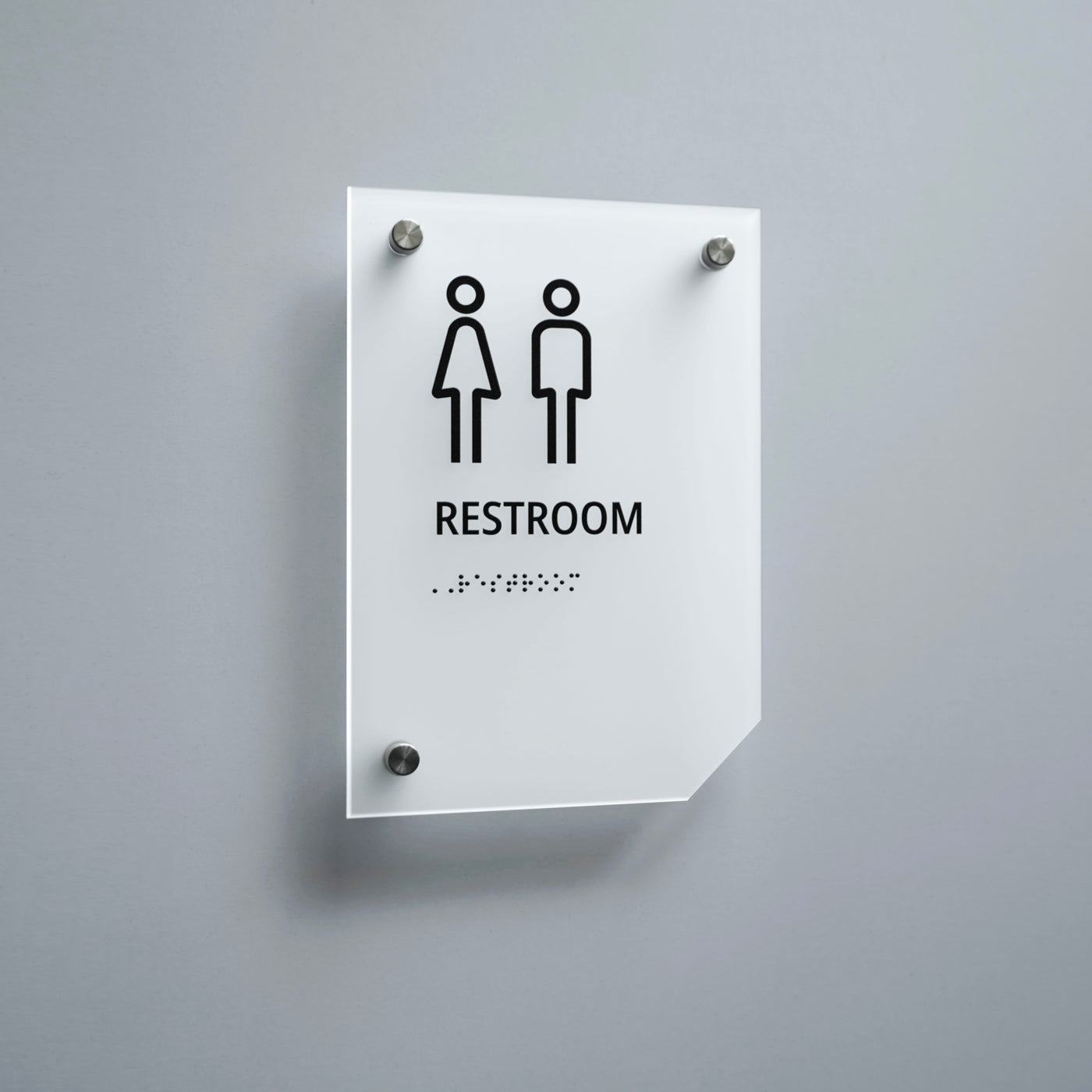 a restroom sign mounted on a wall