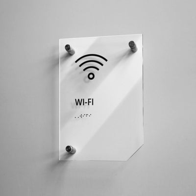 a white sign with a wifi symbol on it