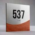 Jure design room number sign 537 with raised numerals and Braille, brushed metal and wood interior signage - Photo #8