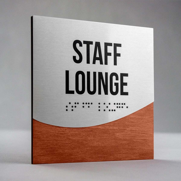 Jure design staff lounge sign with raised lettering and Braille, brushed metal and wood interior signage