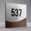 Room number 537 sign in Jure design with Braille, brushed metal panel combined with wooden backing - Photo #3